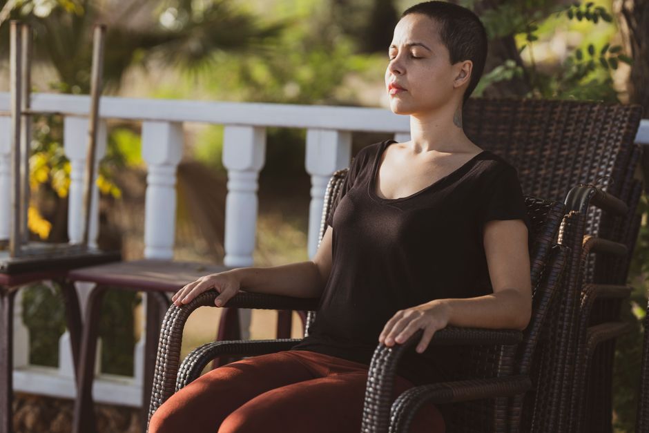 A teacher guiding a group breathwork session