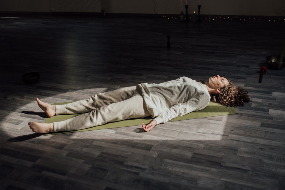 A student fully supported in a restorative pose