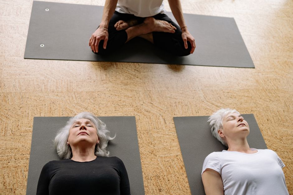 Blankets and bolsters arranged for restorative yoga