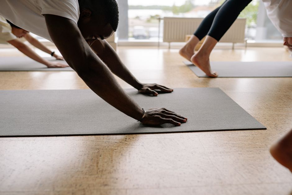 Vinyasa students moving through a standing sequence