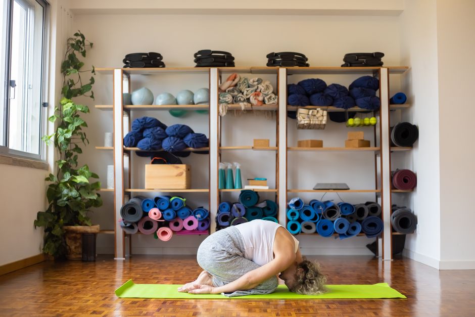 A long-held yin yoga stretch on the floor